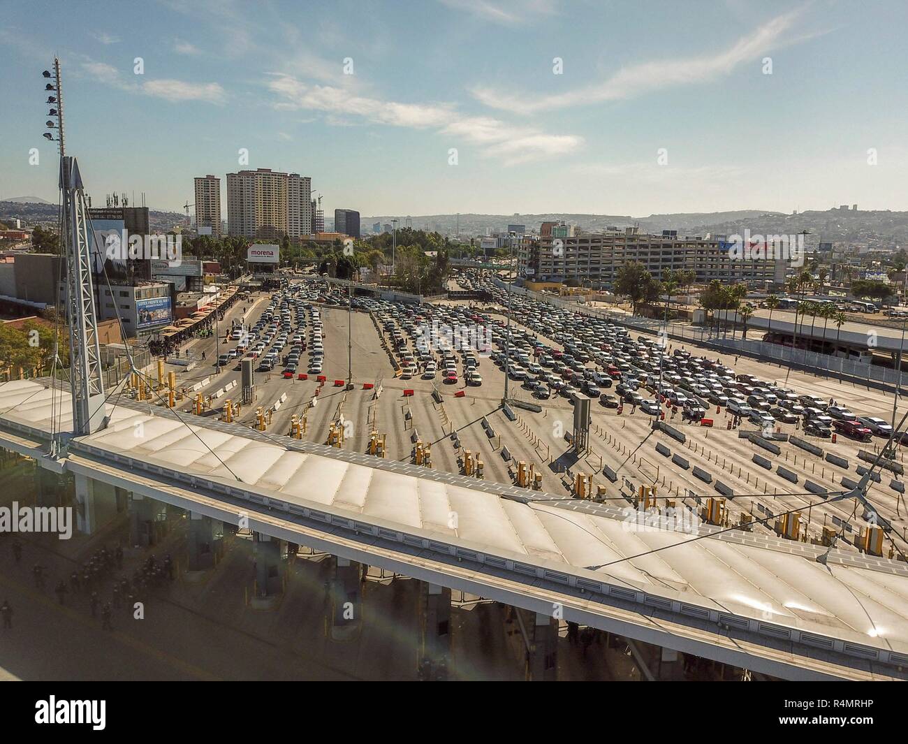 Vehicles line up at the border into the United States from Mexico as Customs and Border Patrol shut it down at the San Ysidro crossing after members of the migrant caravan attempted to illegally cross November 25, 2018 in San Ysidro, California. Stock Photo