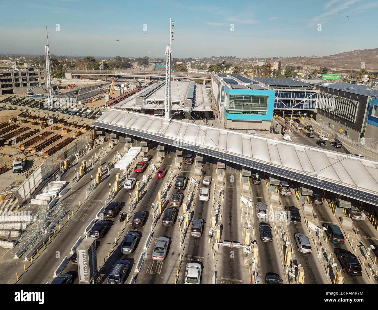 Vehicles line up at the border into the United States from Mexico as Customs and Border Patrol shut it down at the San Ysidro crossing after members of the migrant caravan attempted to illegally cross November 26, 2018 in San Ysidro, California. Stock Photo