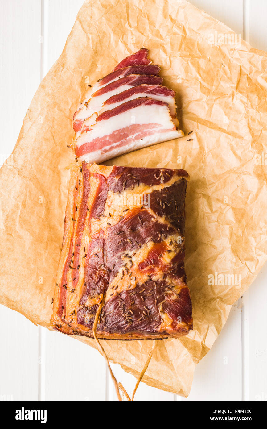 https://c8.alamy.com/comp/R4MT60/sliced-smoked-bacon-on-wrapping-paper-top-view-R4MT60.jpg