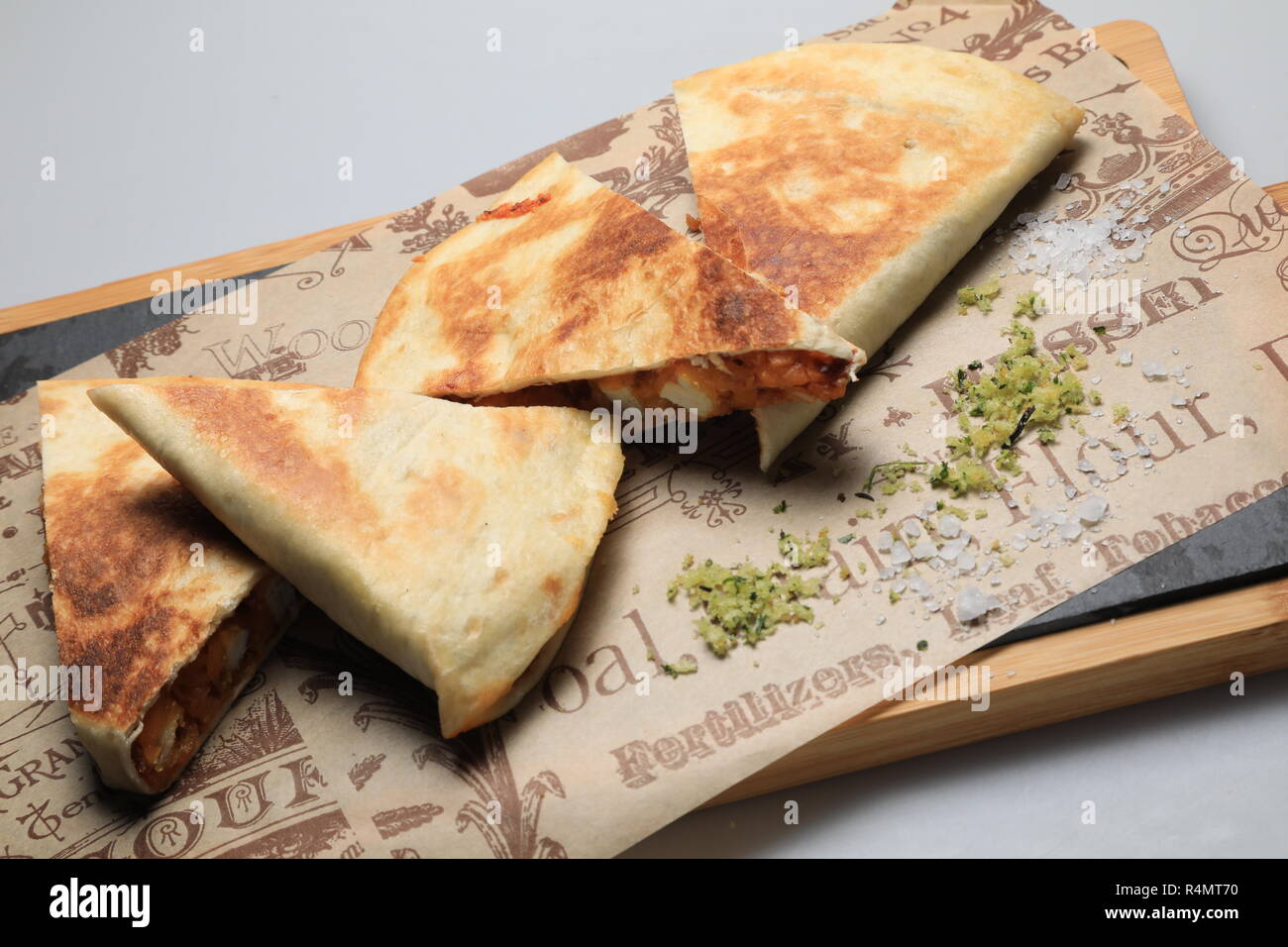 A shot of a tortilla sandwich cut in several pieces Stock Photo