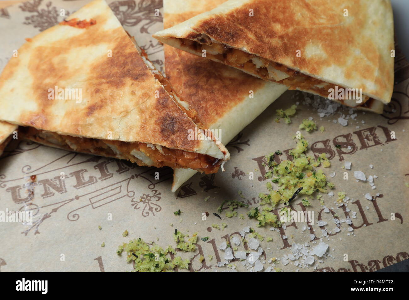 A shot of a tortilla sandwich cut in several pieces Stock Photo