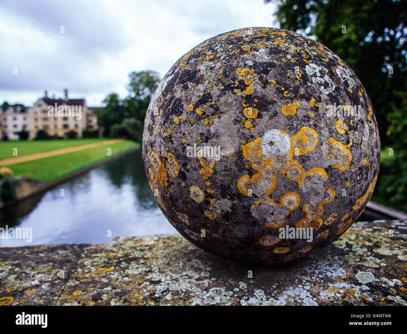 Lichen Dotted Stone Ball on Bridge Over River Cam in Cambridge Stock Photo