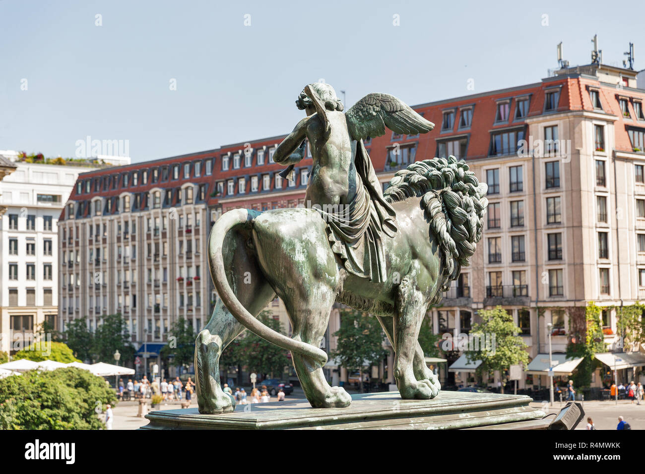 Bronze lion statue in front of the Berlin Concert Hall or Konzerthaus on Gendarmenmarkt square, Germany. Side view. Stock Photo