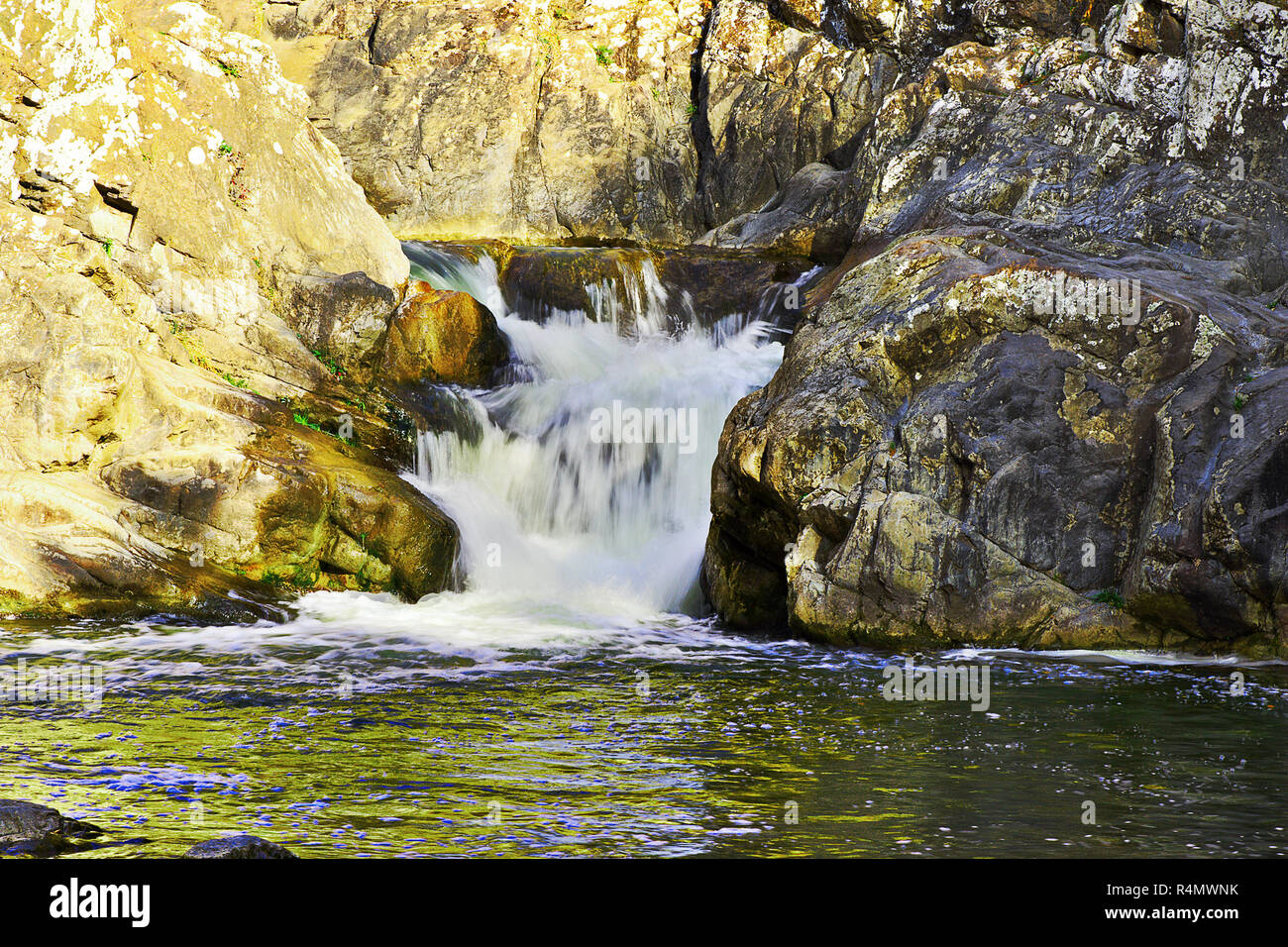 beautiful waterfall, water flowing over rocks Stock Photo