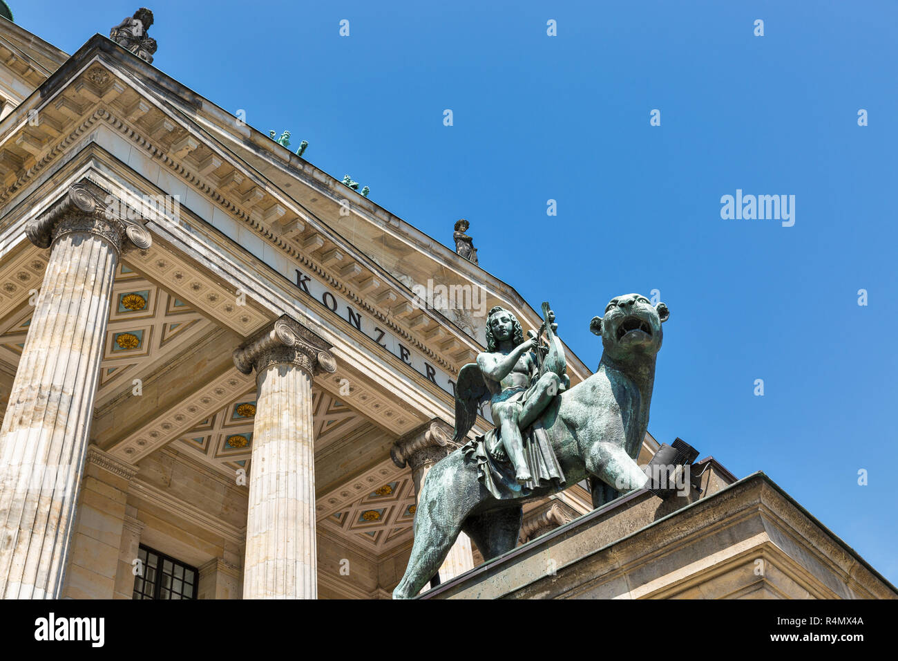 Bronze lion statue in front of the Berlin Concert Hall or Konzerthaus on Gendarmenmarkt square, Germany. Bottom view. Stock Photo