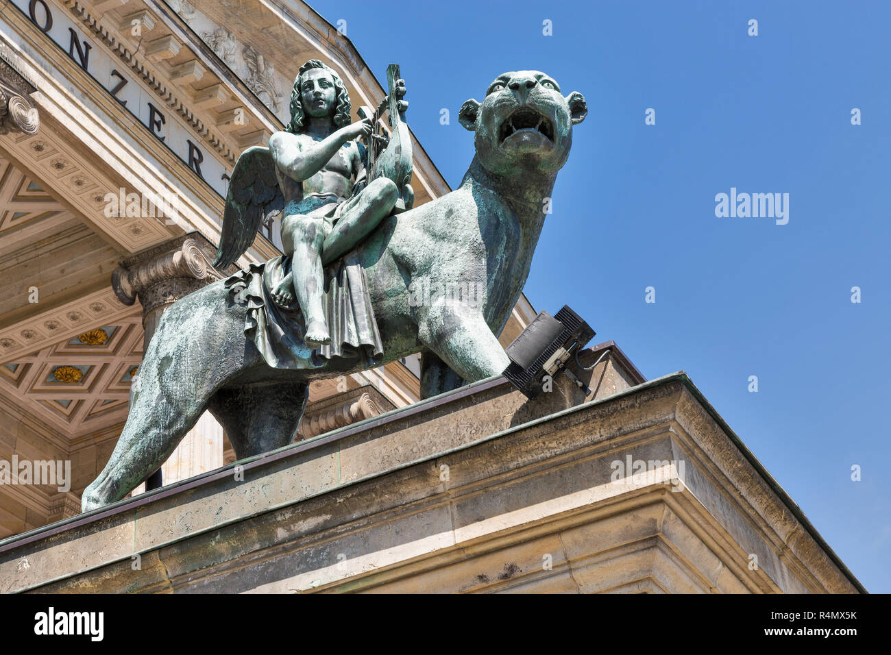 Bronze lion statue in front of the Berlin Concert Hall or Konzerthaus on Gendarmenmarkt square, Germany. Bottom view. Stock Photo