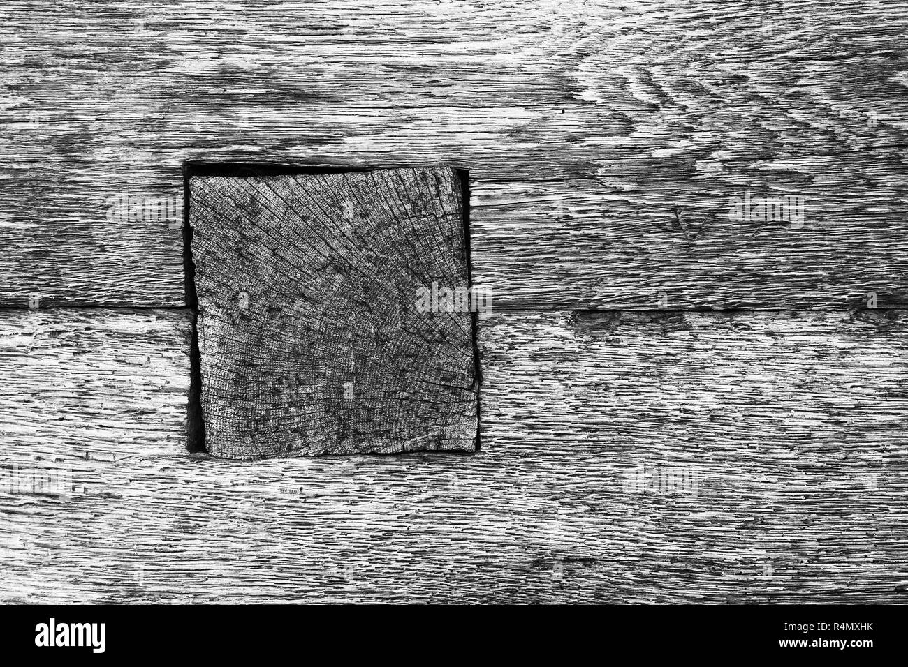 detail of wooden beam joint on old log house, black and white textural image Stock Photo