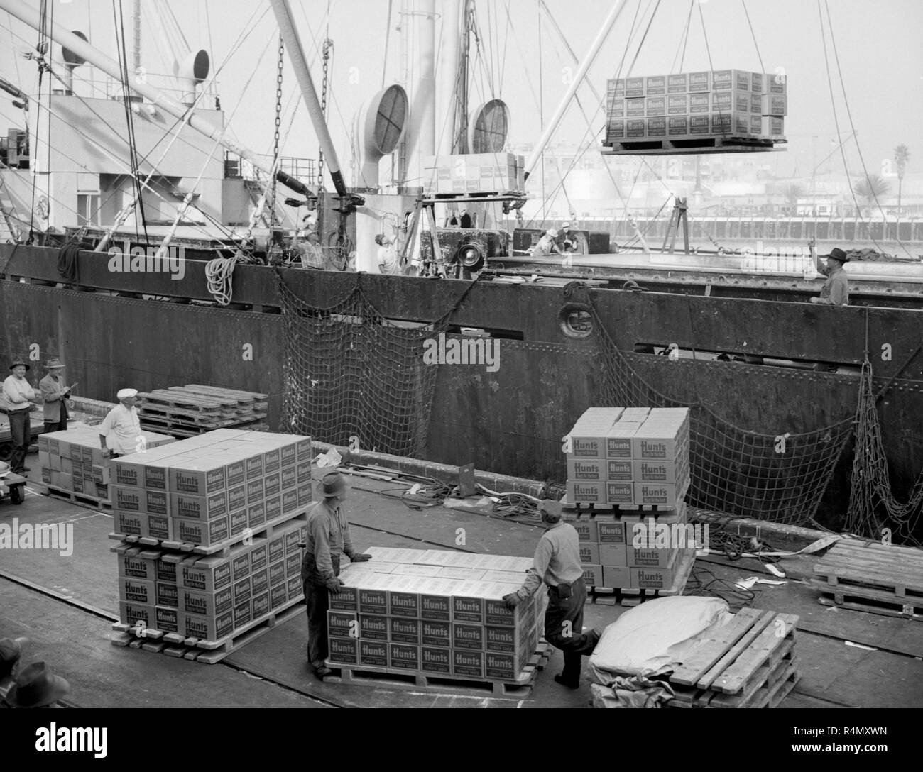 A ship is unloaded at the Port of Los Angeles in California, ca. 1955. Stock Photo