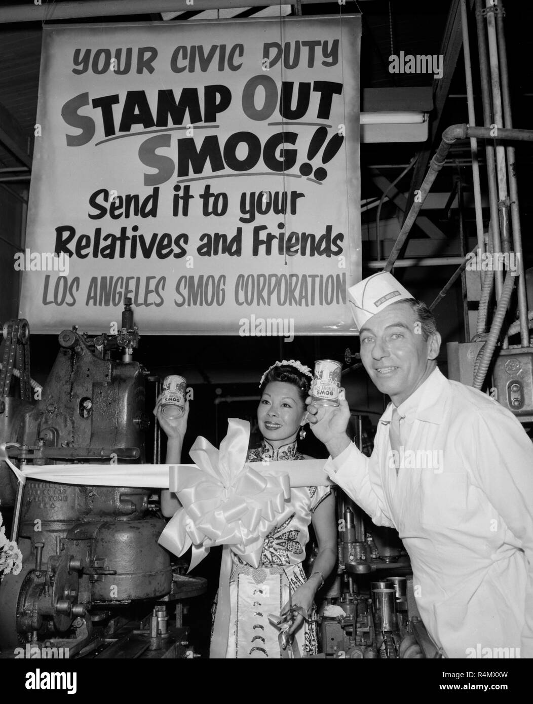 Actor Carleton Young promotes his smog in a can product, ca. 1957. Stock Photo