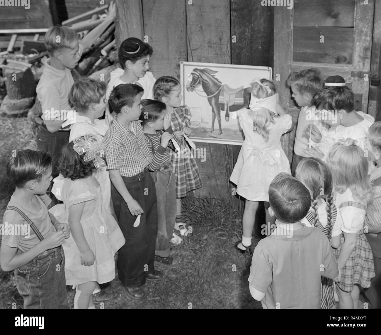 Scene from a classic child's backyard birthday party in California, ca. 1949. Stock Photo