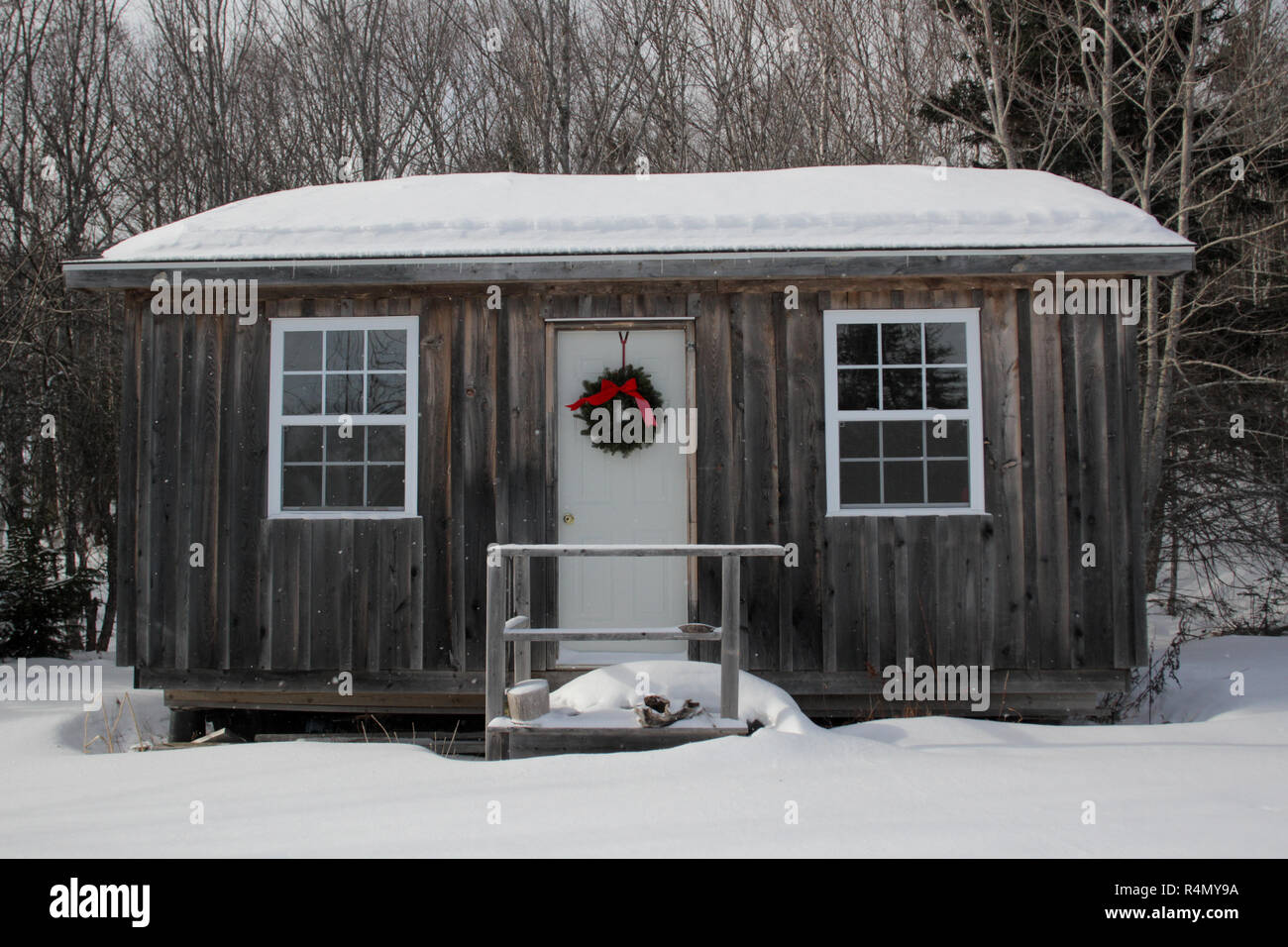 A small cabin in the woods of Cape Breton, Nova Scotia decorated for