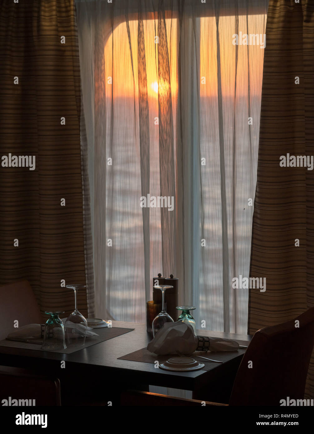 Table for two in shipboard restaurant by window Stock Photo