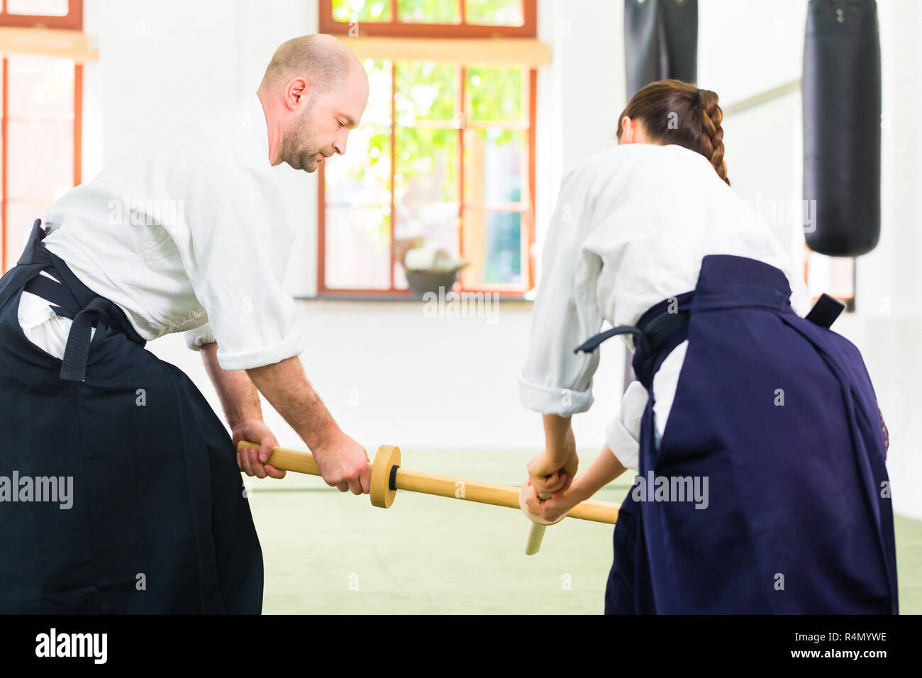 Man and woman having Aikido sword fight Stock Photo Alamy
