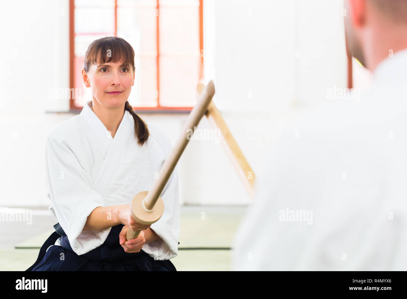 Man and woman having Aikido sword fight Stock Photo Alamy