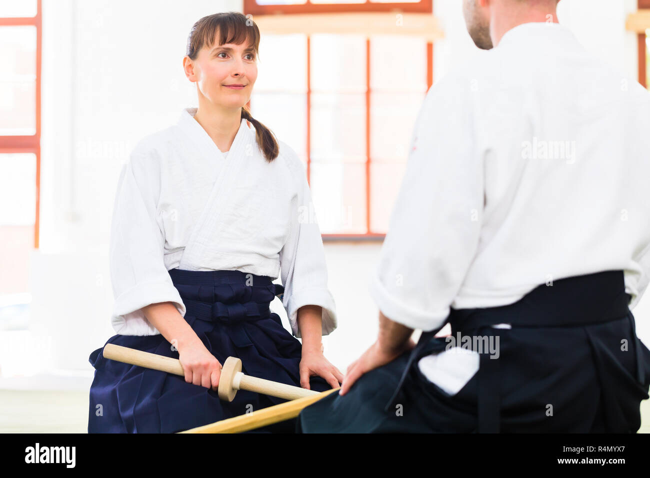 Man and woman having Aikido sword fight Stock Photo Alamy