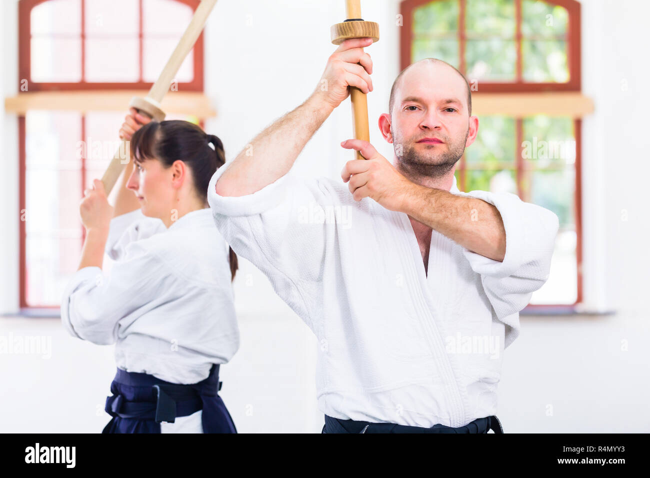 Man and woman having Aikido sword fight Stock Photo Alamy