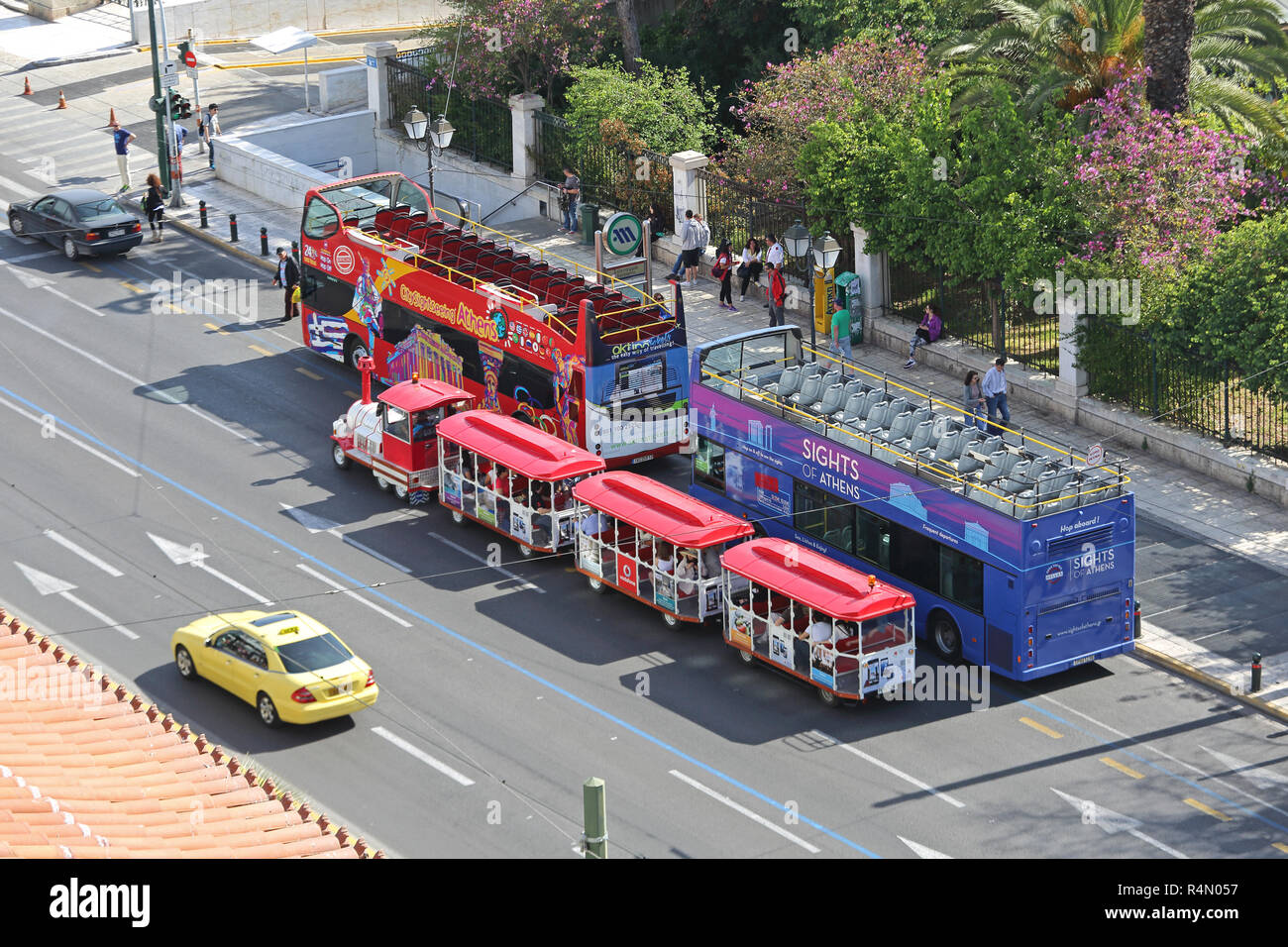 ATHENS, GREECE - MAY 02: Open Tour Buses and Tourists Train in Athens on MAY 02, 2015. Small Train and Tourist Coach Parked Near Syntagma Square in At Stock Photo