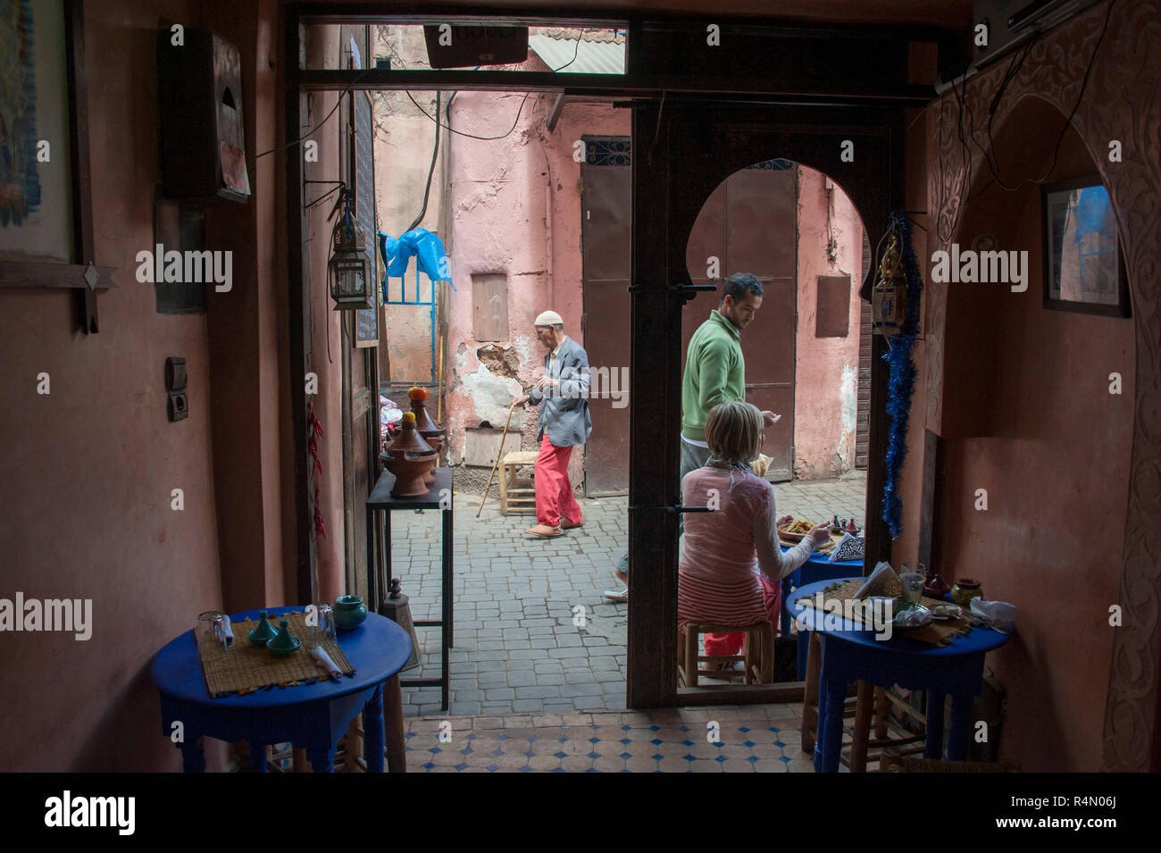 18-04-11. Marrakech, Morocco.  Street scene in the medina, photographed from inside a cafe looking out. Photo © Simon Grosset / Q Photography Stock Photo