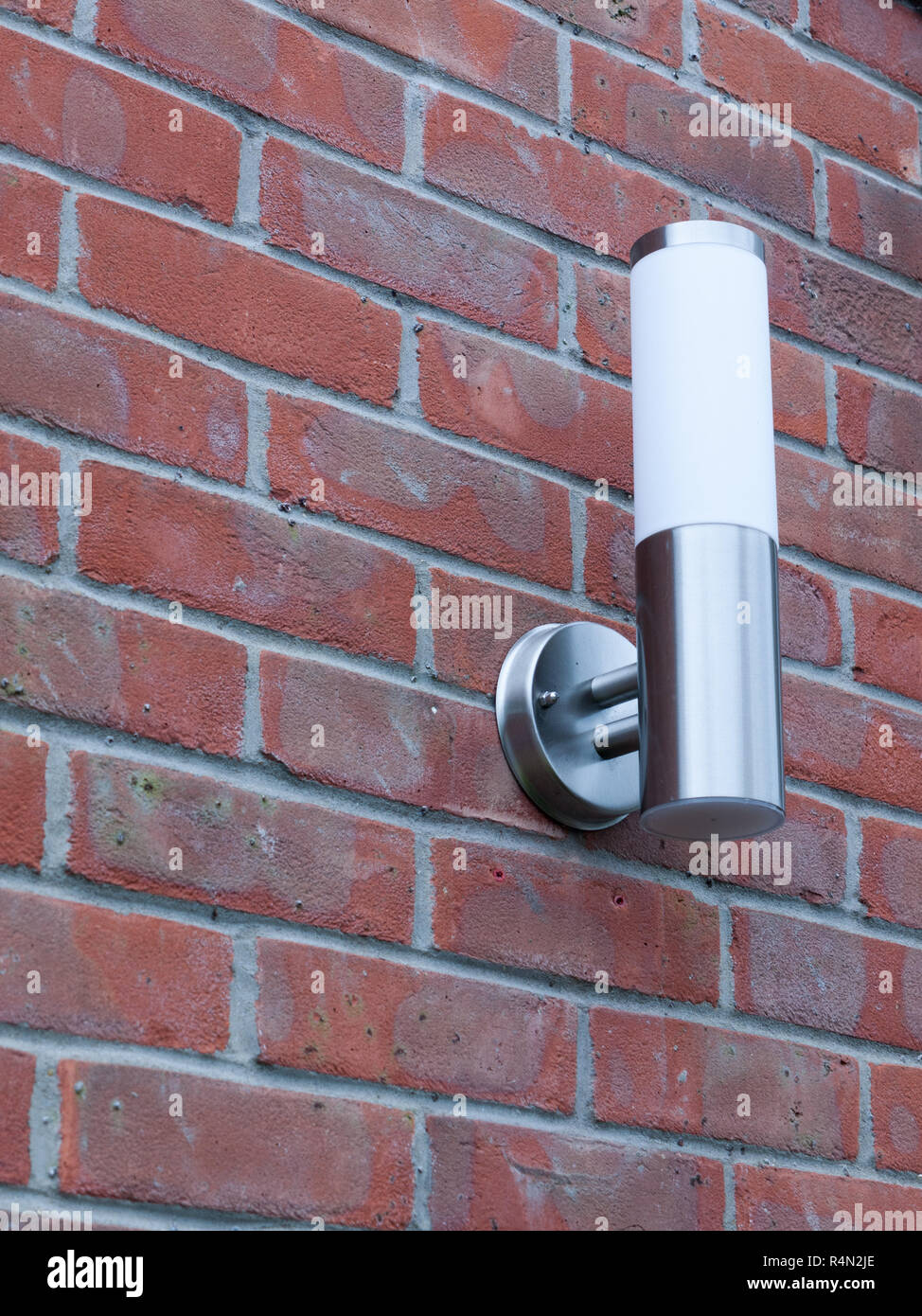 outside light not working on An Outside Metal And White Modern Lamp Turned Off Not On Near Front Door In The Day Light And On Brick Wall Behind Stock Photo Alamy