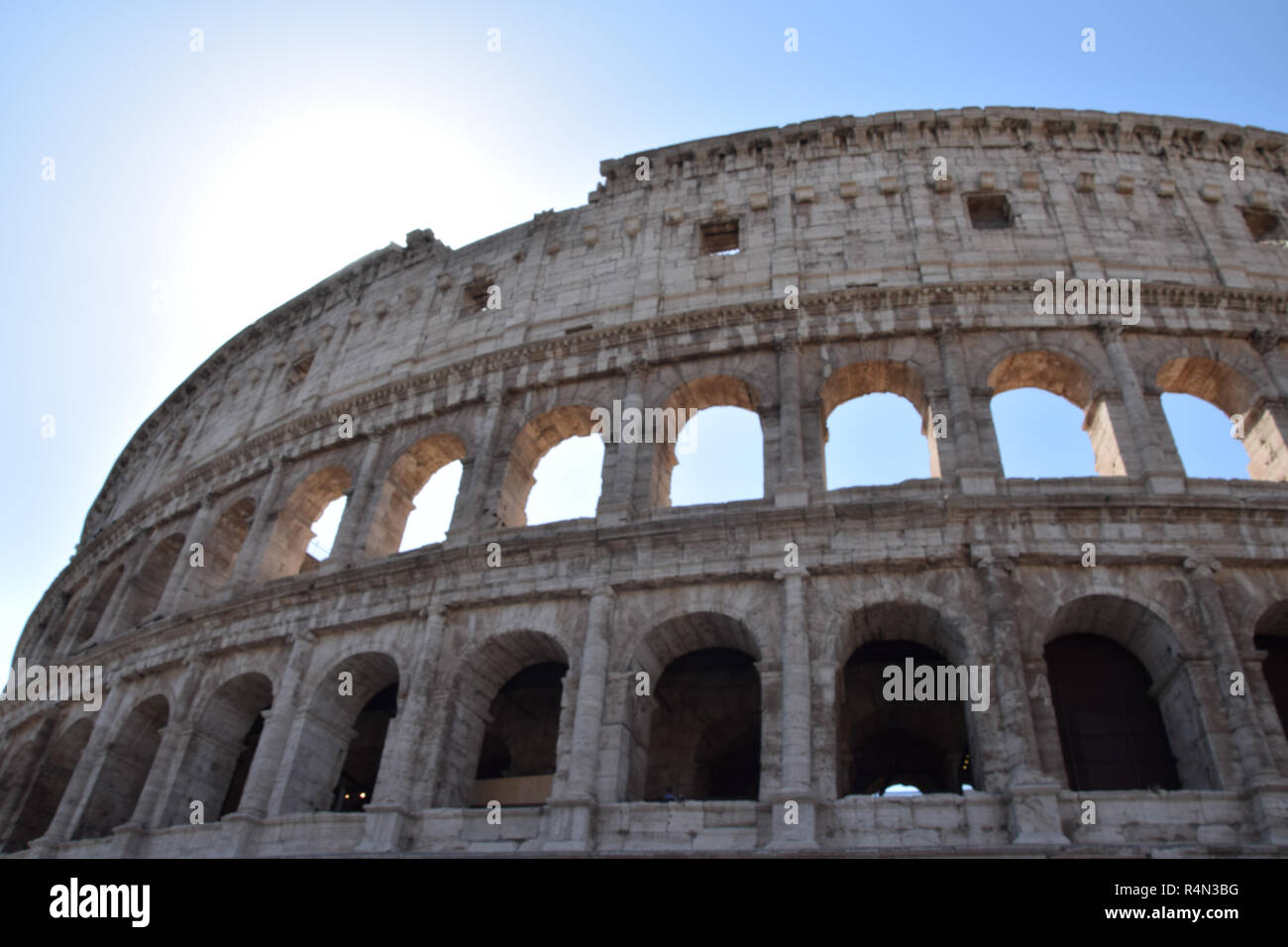 The Shell Rome The sun shining behind the shell of the colosseum in Rome Stock Photo ...