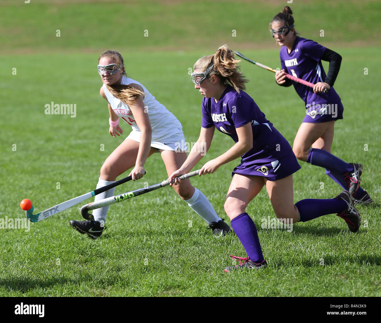 High school girls playing field hockey Stock Photo - Alamy