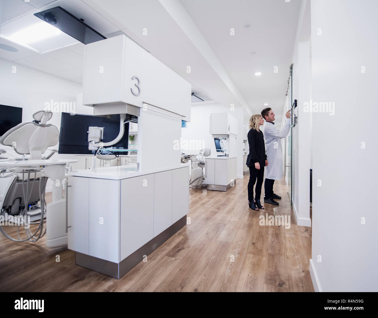 Dentist and assistant in corridor Stock Photo