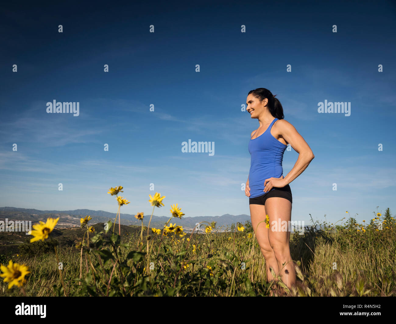 Tall woman standing arms hi-res stock photography and images - Alamy