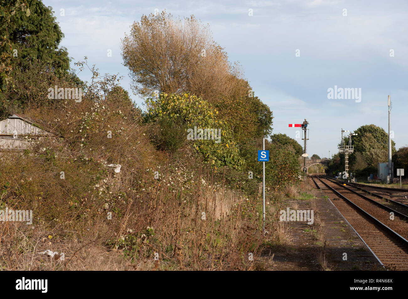 Oulton Broad North Railway Station, Suffolk, Looking east showing an unused and weed bound platform. Stock Photo