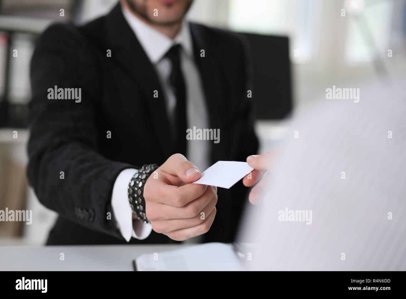 man give businesscard in office Stock Photo