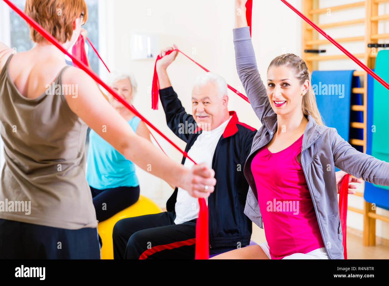 Senior people at fitness course in gym Stock Photo