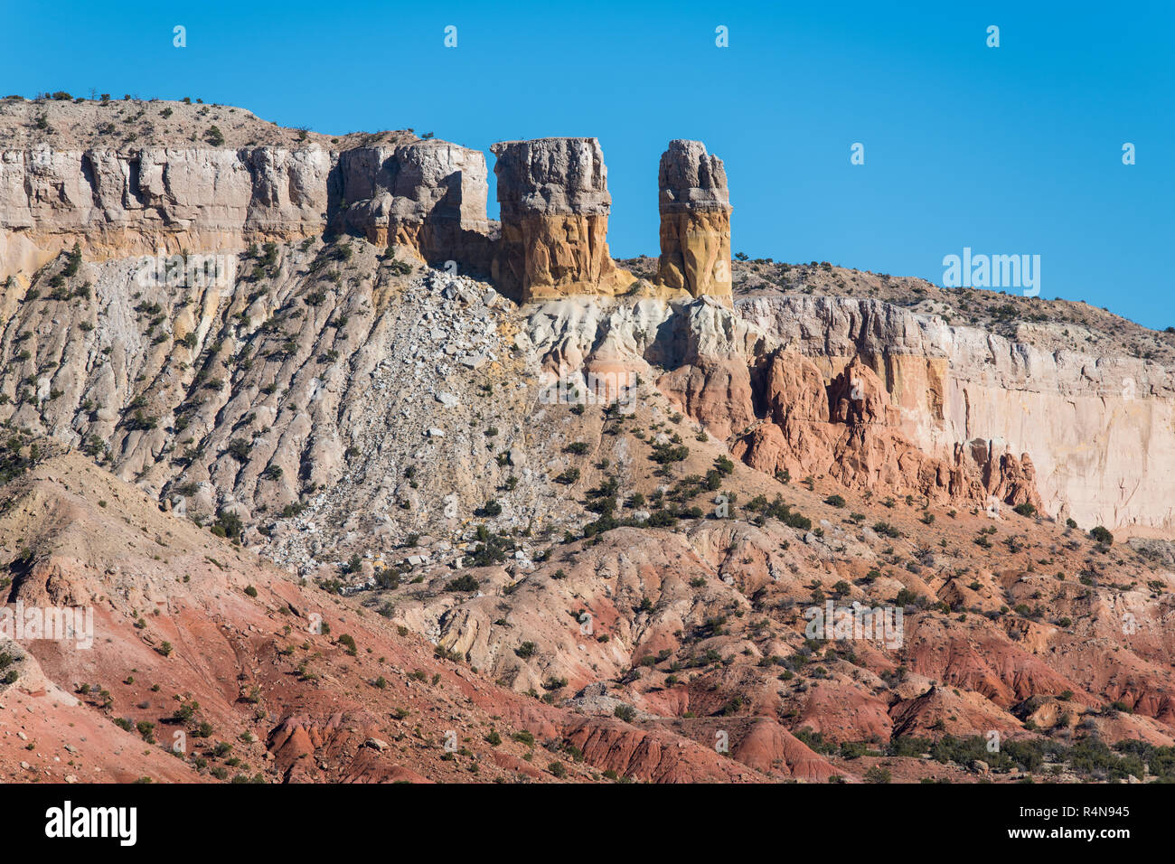Colorful rock formations and towers in the desert landscape of Ghost Ranch near Abiquiu, New Mexico in the American Southwest Stock Photo