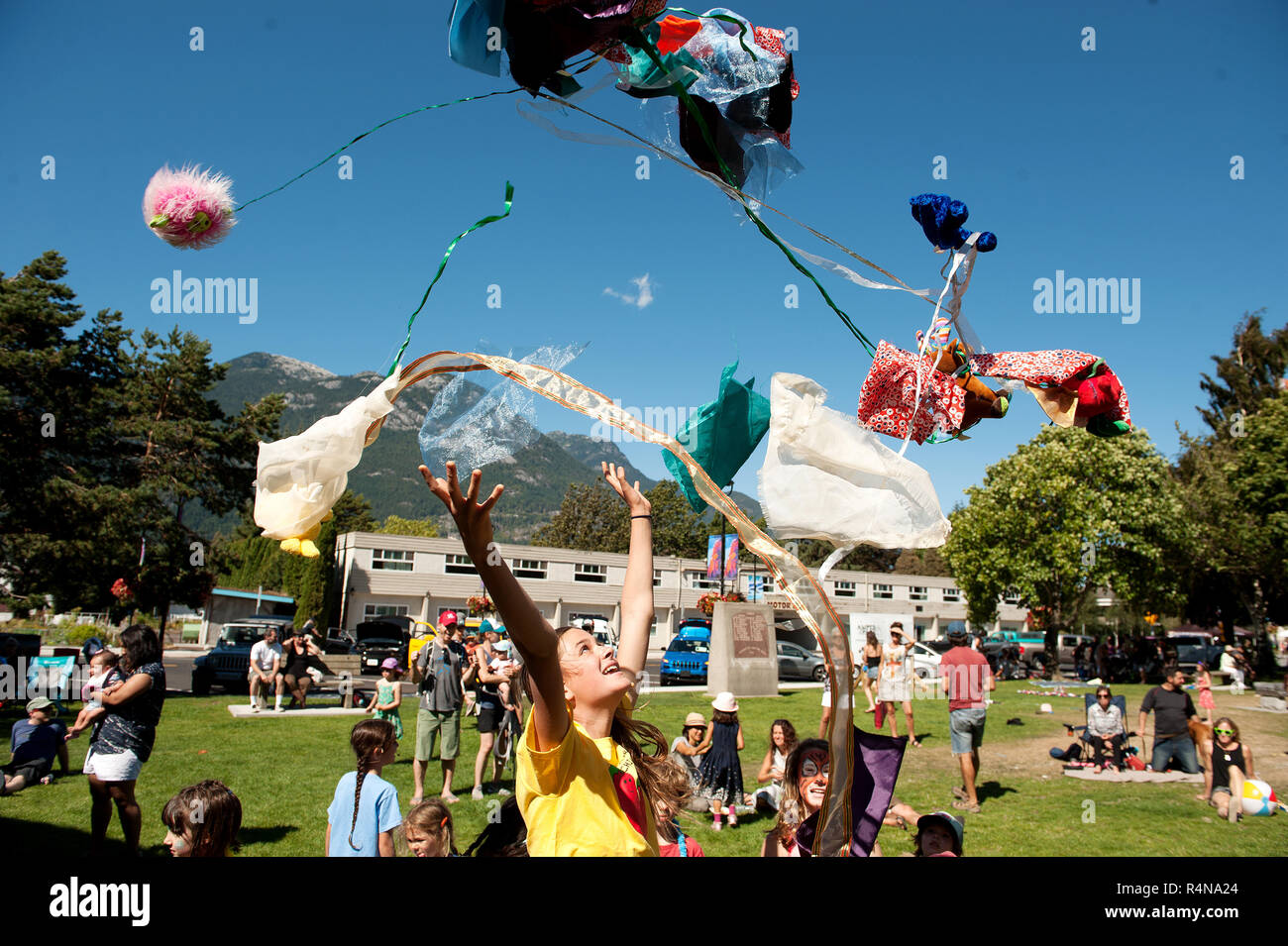 Thirteen year old Emma Springman throws an armful of costumes in the air during her family band, The Springmans, performance at the Squamish Children' Stock Photo