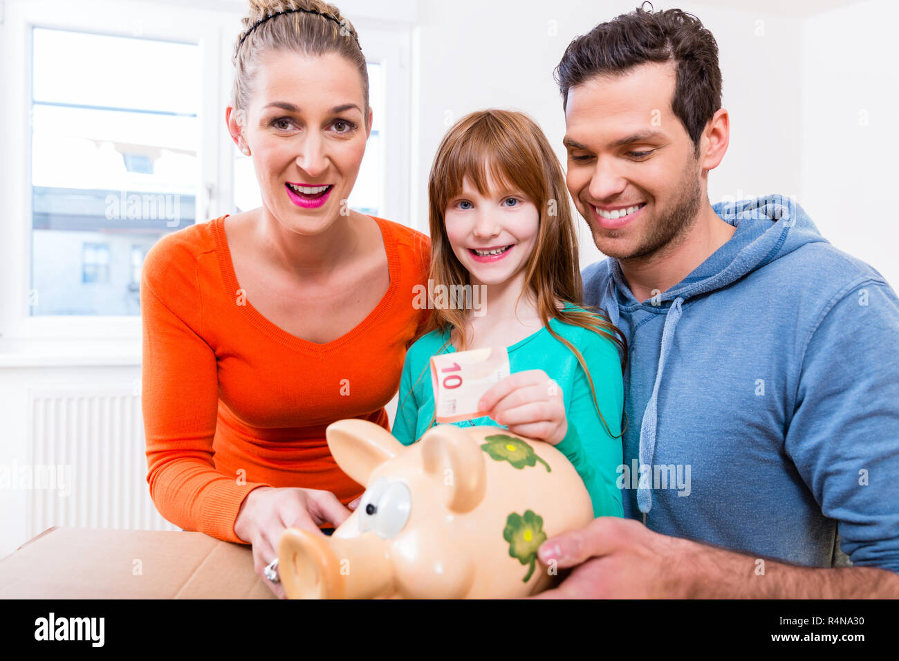 Mom and daughter saving money hi-res stock photography and images - Alamy