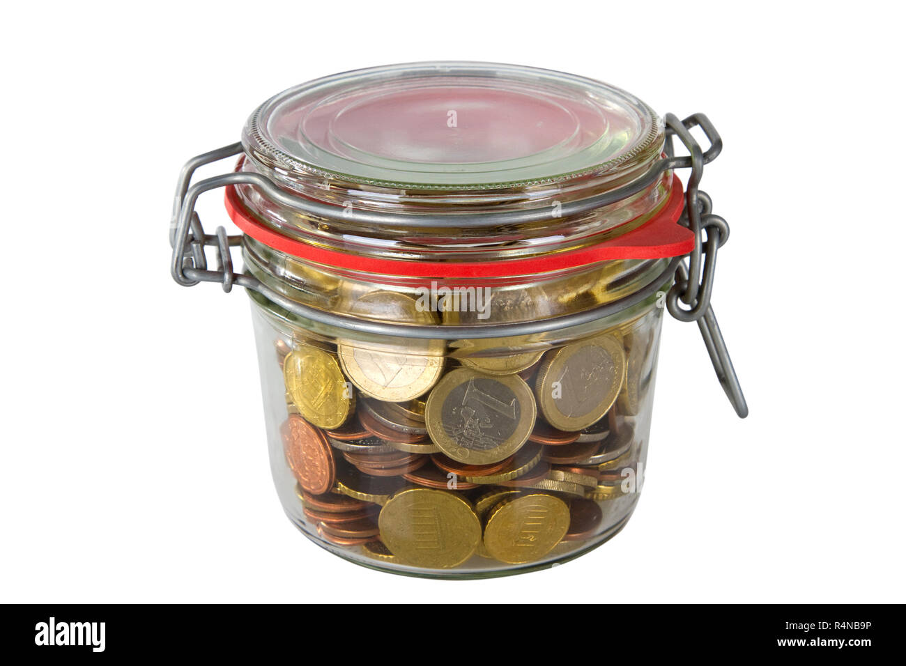 mason jar filled with money coins Stock Photo