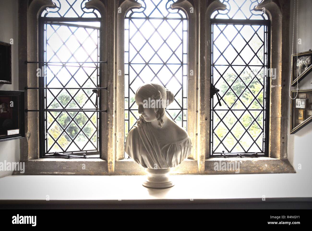 A marble bust of a Tudor female in a lattice window at Sudeley Castle, Gloucestershire Stock Photo