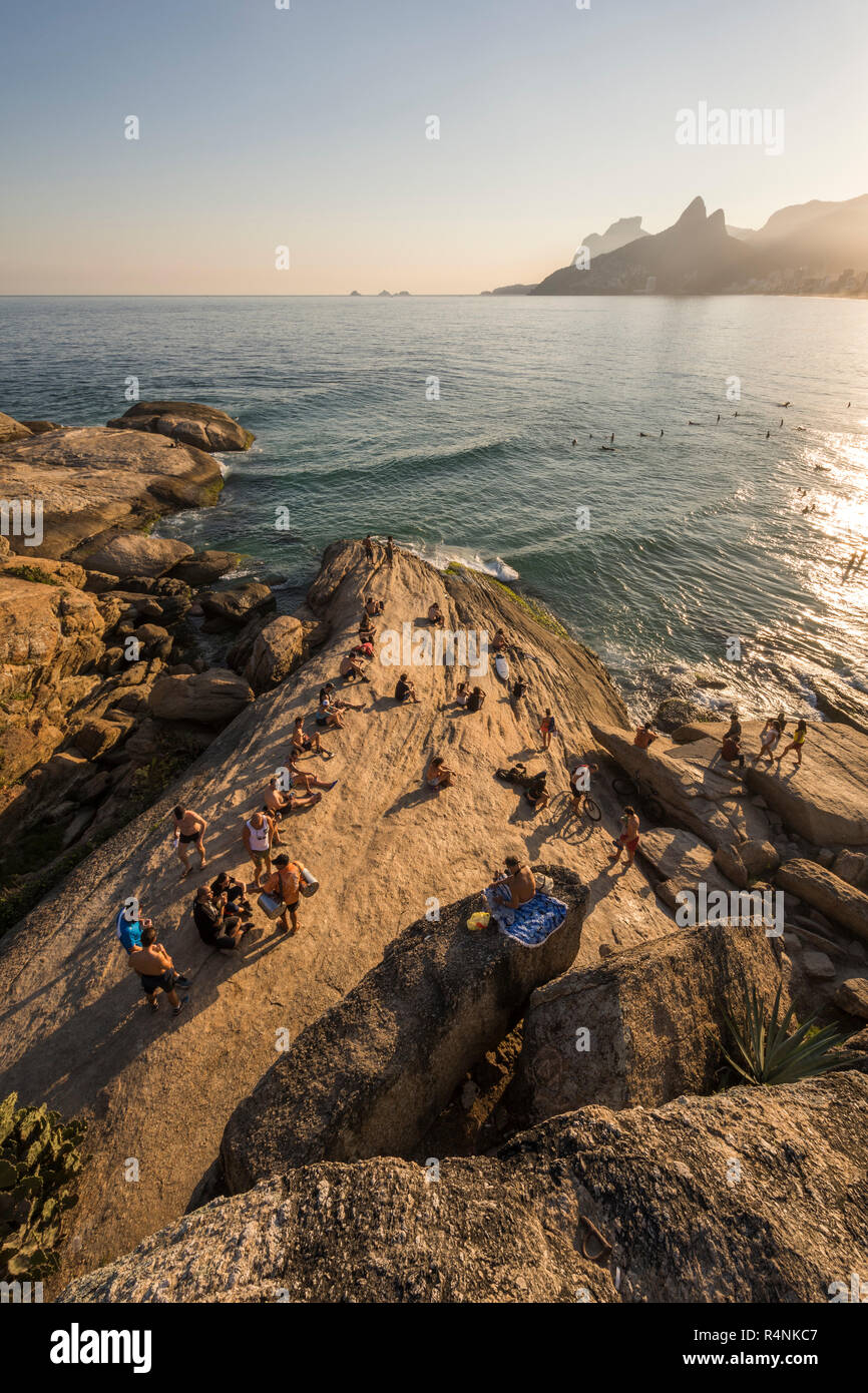 Elevated view of group of tourists on seashore onâ Arpoadorâ rock, Ipanemaâ Beach, Rioâ deâ Janeiro, Brazil Stock Photo