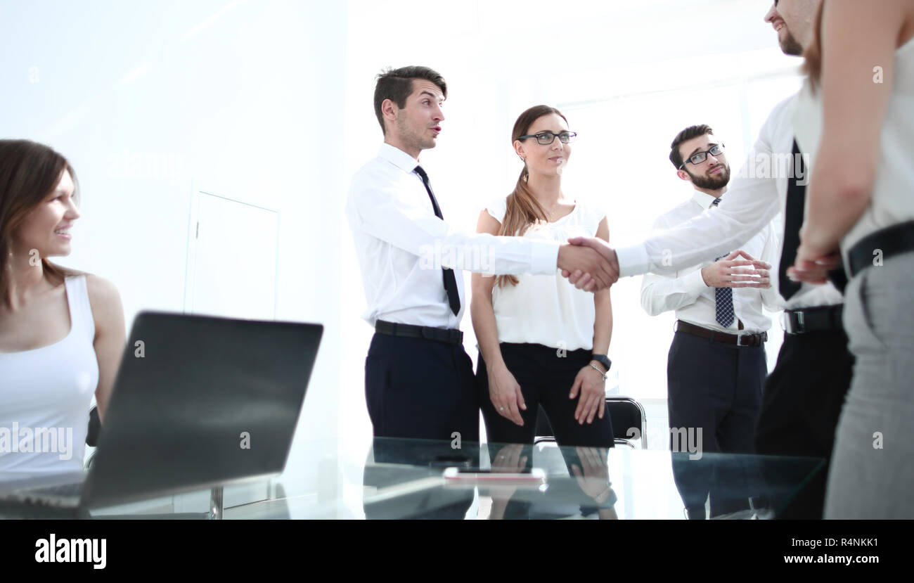 project Manager shaking hands with an employee of the company Stock ...