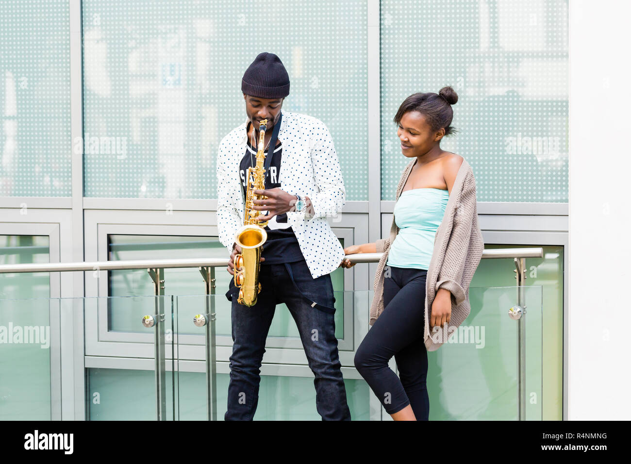 African couple playing Saxophone Stock Photo
