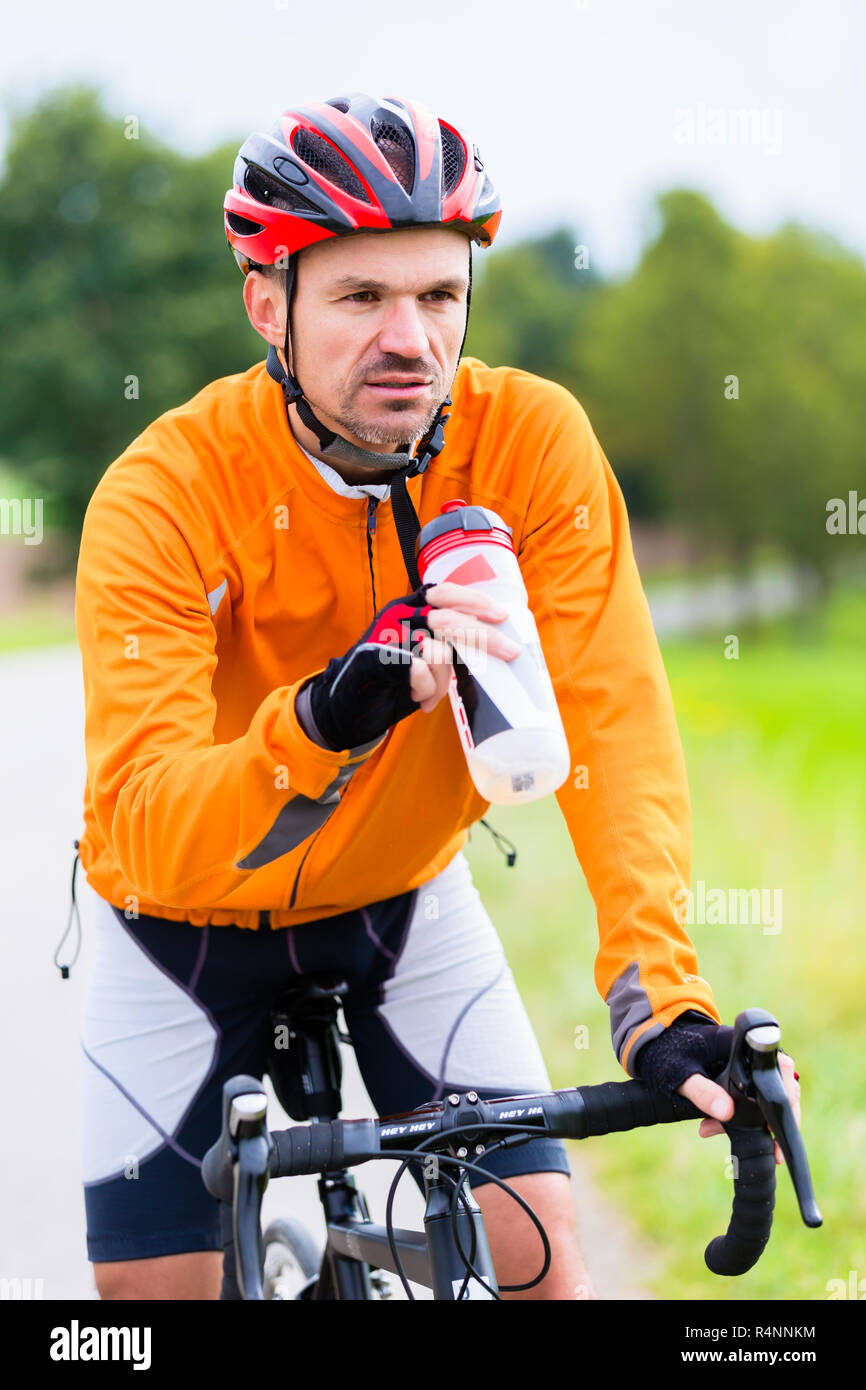 Cyclist on race bike pedaling on bike track Stock Photo Alamy