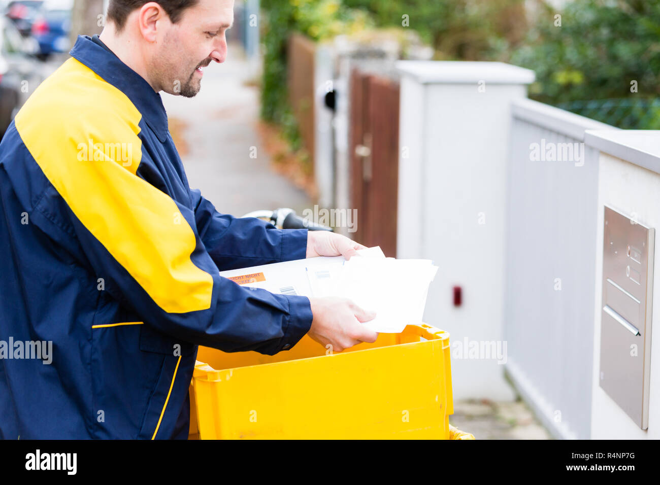 Postman Delivering Letters High Resolution Stock Photography and Images
