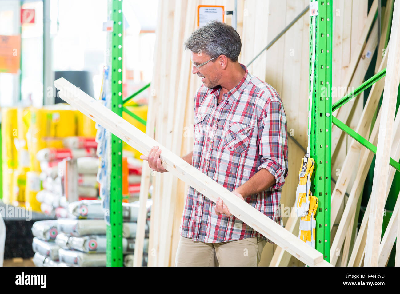 Customer in lumber department of hardware store Stock Photo Alamy