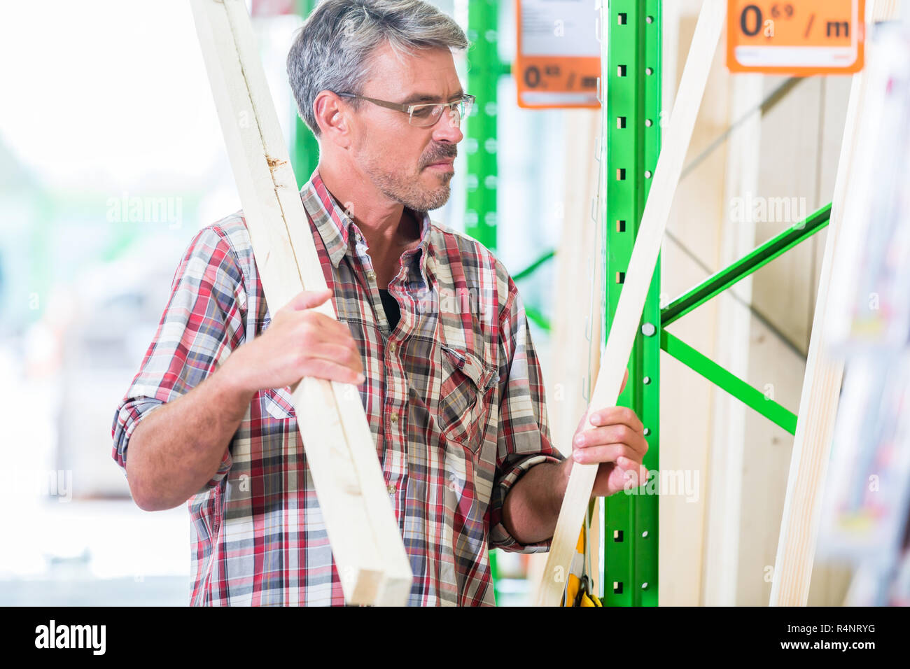 Customer in lumber department of hardware store Stock Photo Alamy