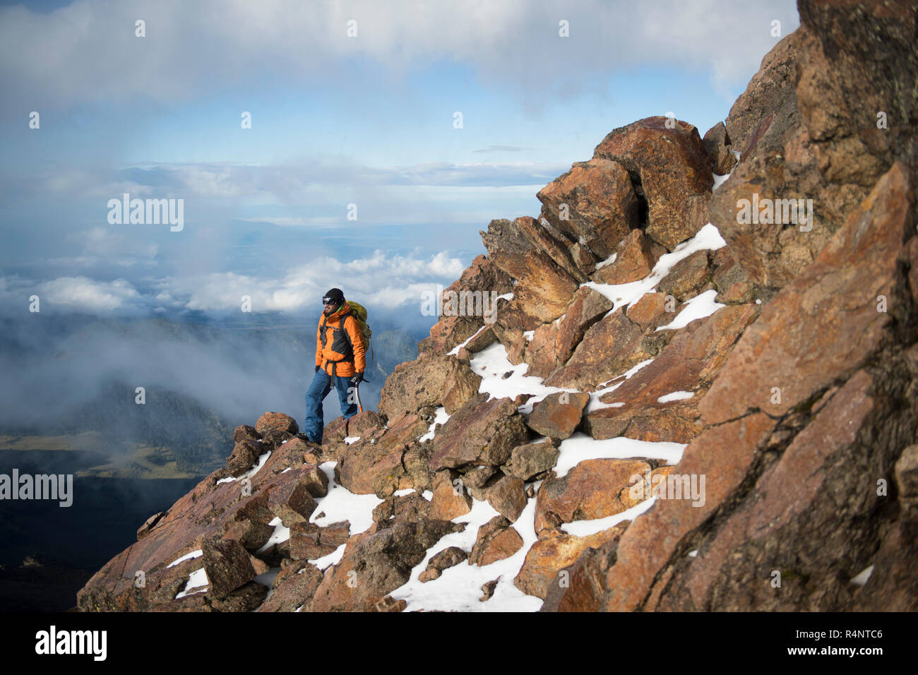 One man hiking trough a rocky section on his ascent to the Iztaccihuatl volcano at theÂ Izta-Popo Zoquiapan National ParkÂ in Puebla, Mexico Stock Photo