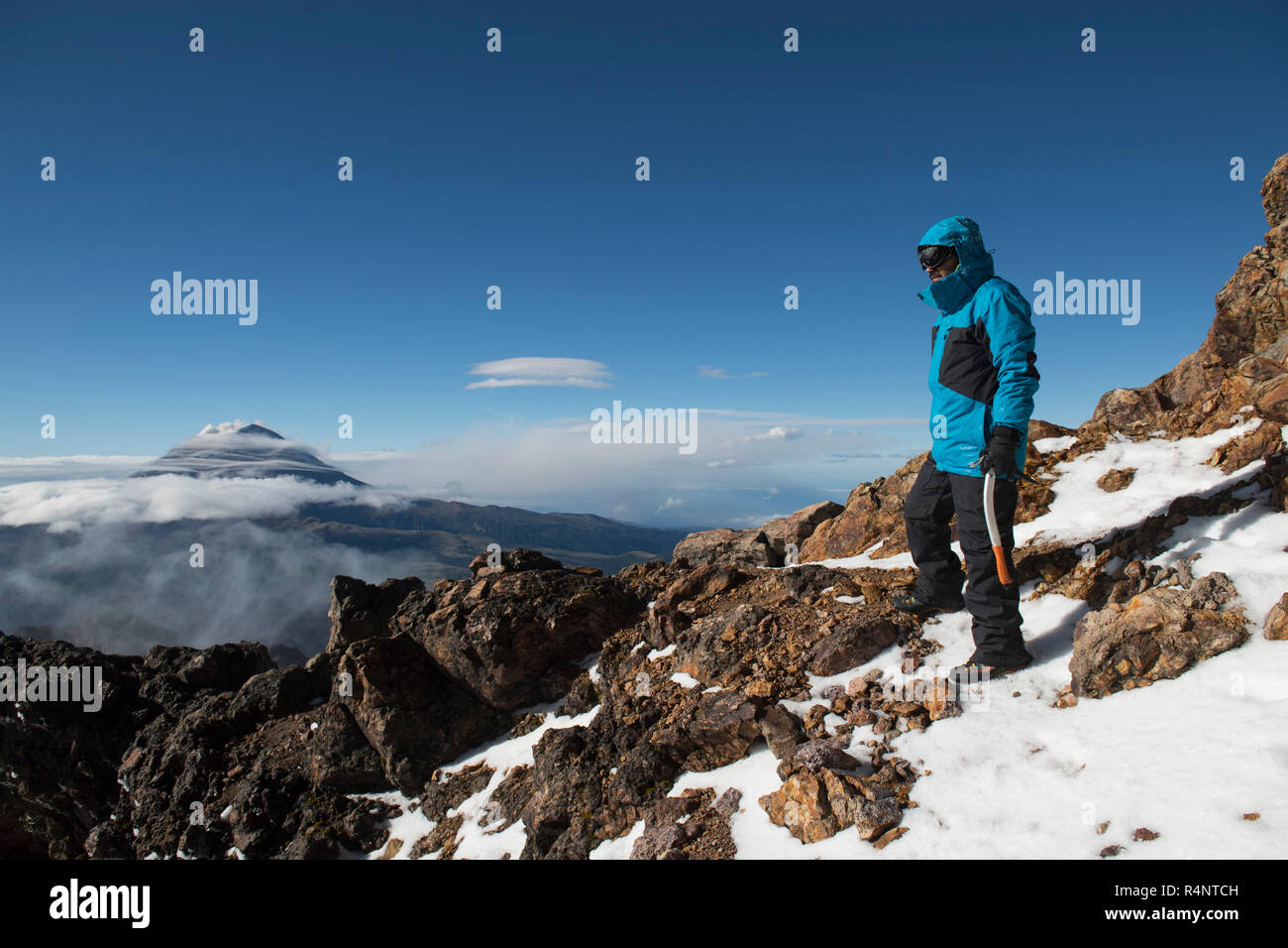 One man stops to watch the landscape while climbing the Iztaccihuatl volcano at theÂ Izta-Popo Zoquiapan National ParkÂ in Puebla, Mexico Stock Photo