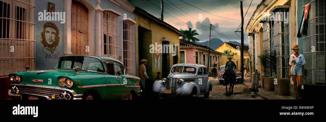 Panorama of street with vintage cars, Trinidad, Â SanctiÂ SpritusÂ Province, Cuba Stock Photo