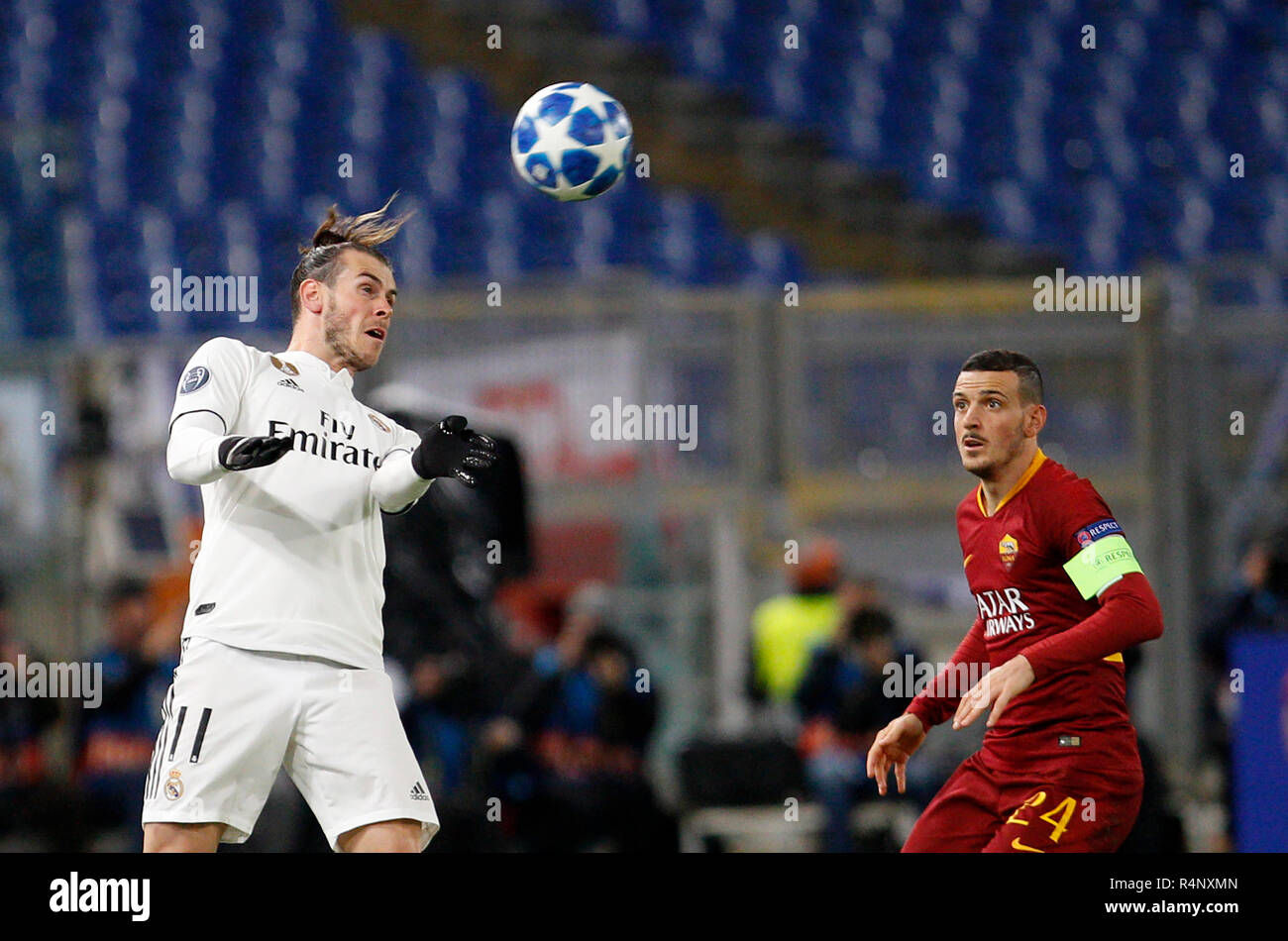Rome, Italy, 27th November, 2018. Real Madrid's Gareth Bale, left, heads  the ball past Roma's Alessandro Florenzi during the Champions League Group  G soccer match between Roma and Real Madrid at the