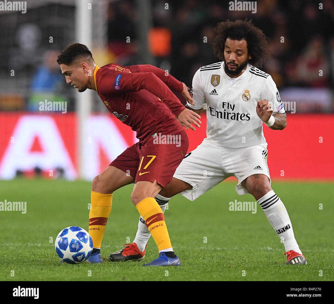 Rome, Italy. 27th Nov, 2018. As Roma's Cengiz Under (L) vies with Real Madrid 's Marcelo during a group G match of UEFA Champions League between Roma and Real Madrid, in Rome, Italy, Nov. 27, 2018. Real Madrid won 2-0. Credit: Alberto Lingria/Xinhua/Alamy Live News Stock Photo