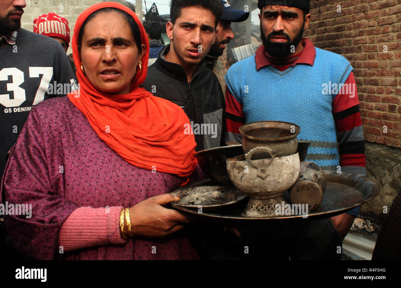 Srinagar, Kashmir. 28th November, 2018. A Kashmiri Muslims women carry ...