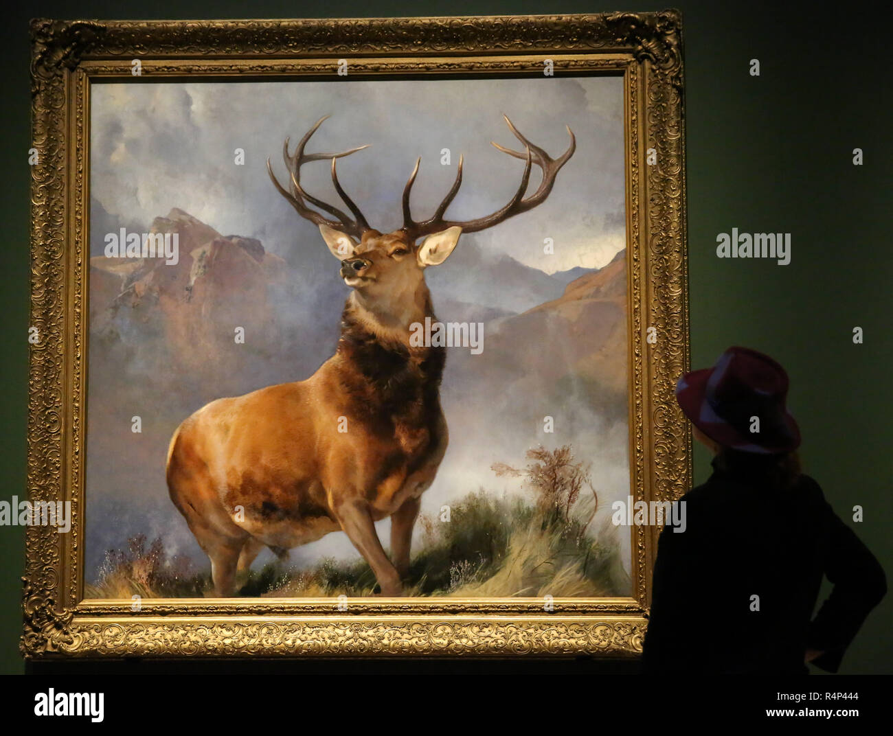 National Gallery. London, UK. 28 Nov 2018 - A woman looks at an oil-on-canvas painting of a red deer stag completed in 1851 by the English painter Sir Edwin Landseer'.     The Monarch of the Glen (about 1985) is one of the most famous British pictures of the nineteenth century; for many people it encapsulates the grandeur and majesty of ScotlandÕs highlands and wildlife.    Credit: Dinendra Haria/Alamy Live News Stock Photo