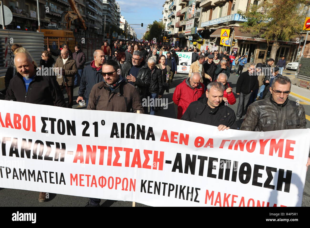 Thessaloniki, Greece, 28th November, 2018.  Protesters from the PAME trade union take part in a demonstration during a 24-hour walkout staged by Greece's largest private sector union GSEE  against planned pension cuts and to demand the reversal of labour reforms implemented under the country's third bailout. The strike by the GSEE union is the second major strike since Greece exited its bailout programme in August. Credit : Orhan Tsolak / Alamy Live News. Stock Photo